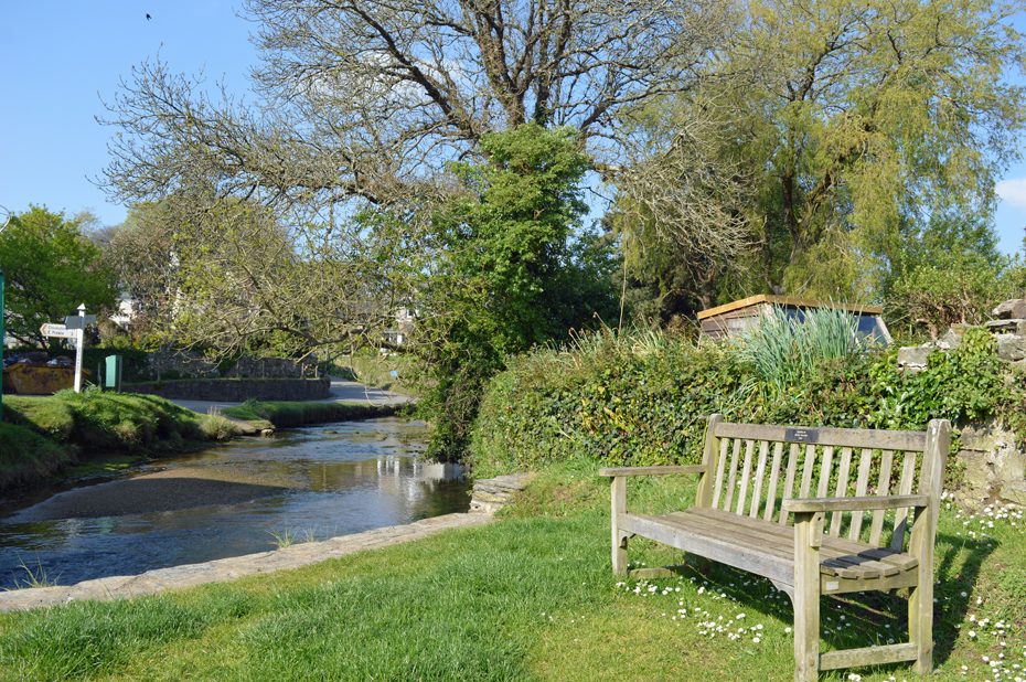A bench by a stream leading to South Pool Creek