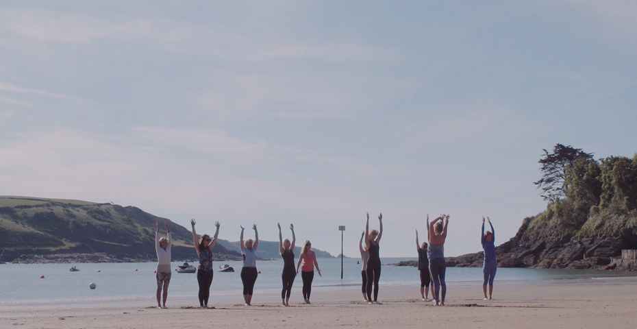 Beach yoga at South Sands - wellbeing holidays in South Devon