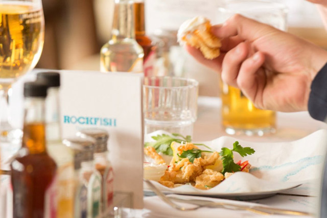 Rockfish restaurant - places to eat - a table with food, drink and condiments.