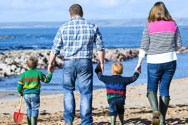 Luxury family holidays - a family on the beach at south milton sands.