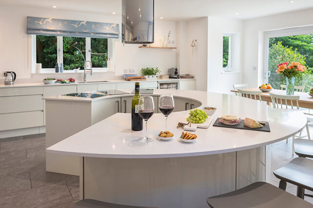 The sands - white modern kitchen with wine and nibbles.