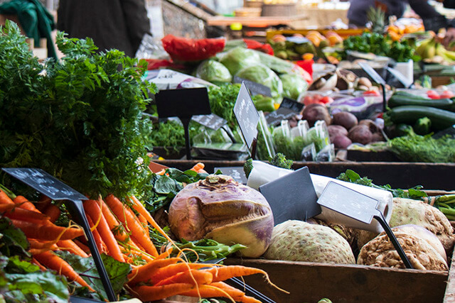 Topsham community market - fresh produce on market stall.