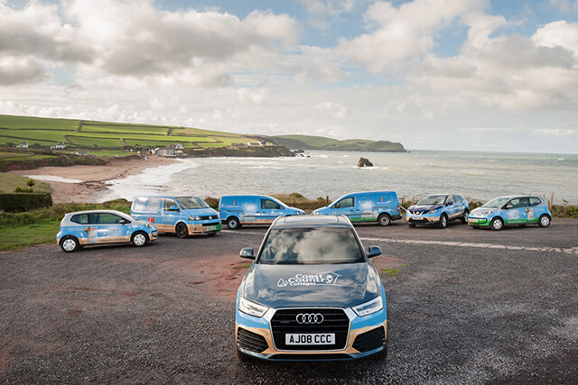 company cars overlooking thurlestone beach.