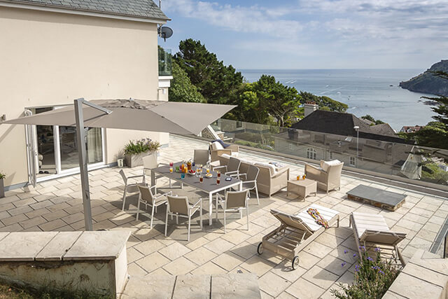 The Sand Salcombe Holiday Home - outdoor terrace with pimms overlooking the sea.