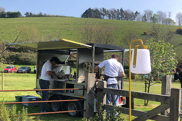 Seahorse Al Mare Luxury Events Caterer - mobile grill in field.