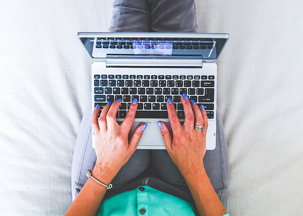 national and local marketing - lady working on laptop.