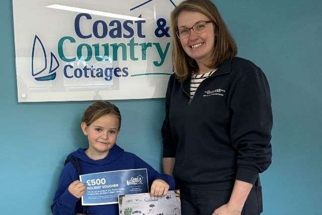 The winner of the Devon Air Ambulance competition Matilda with Vicky from Coast & Country Cottages