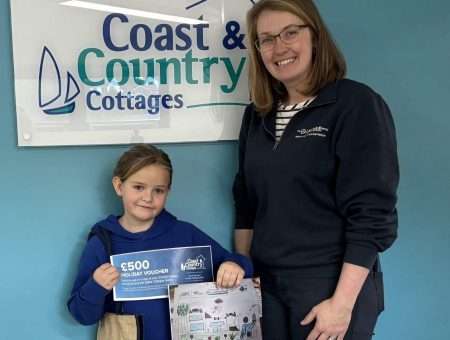 The winner of the Devon Air Ambulance competition with Vicky from Coast & Country Cottages, and her prize