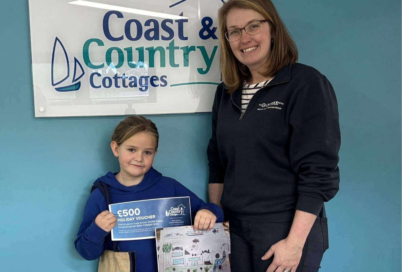 The winner of the Devon Air Ambulance competition with Vicky from Coast & Country Cottages, and her prize