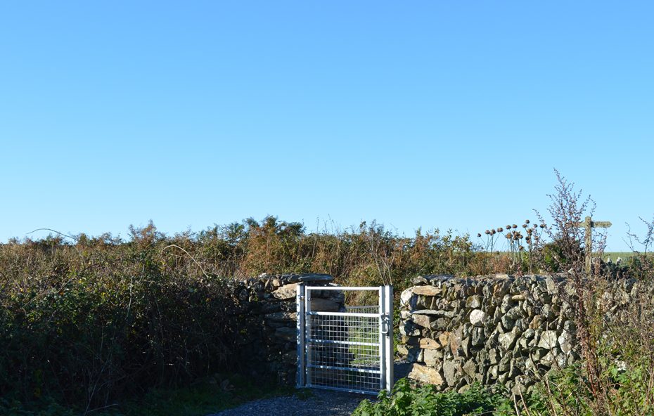 The gate behind the farmhouse